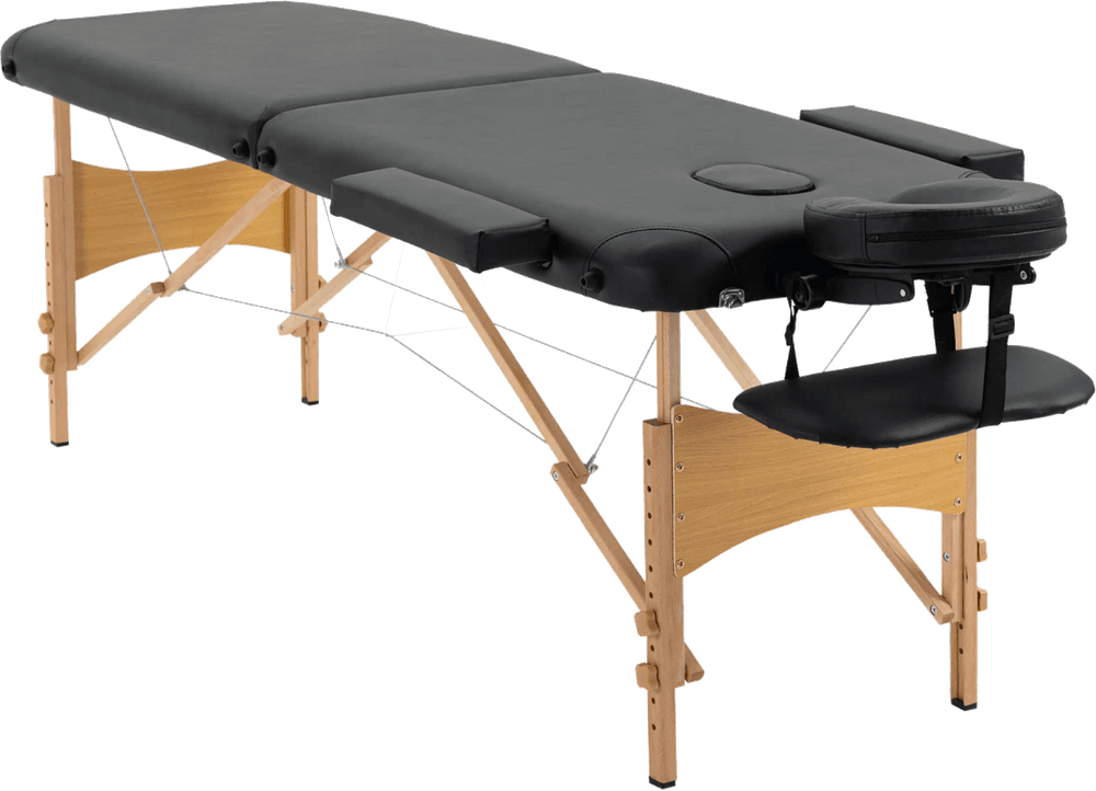 The Massage Table: black padded two-section folding massage table on a beech frame with headrest and arm rest